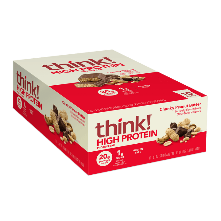 Box of think! High Protein bars, Chunky Peanut Butter flavor. Red and white packaging, highlighting 20g protein, 1g sugar, gluten-free. Bars and peanuts pictured.